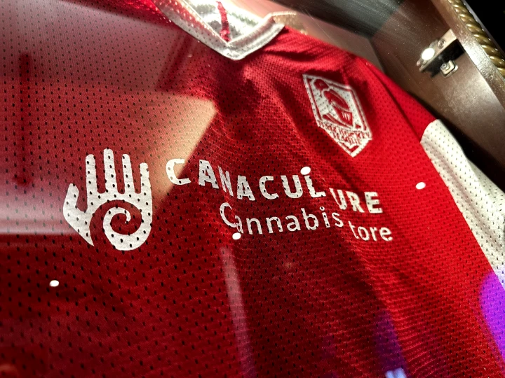 an athletic jersey with the canaculture logo